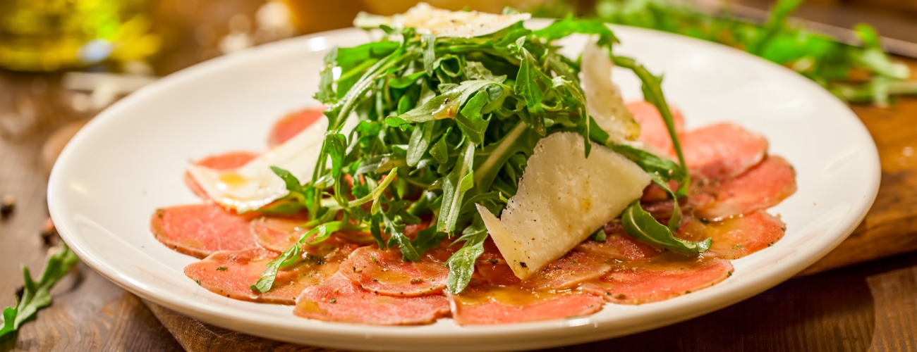 BEEF CARPACCIO WITH GRAPEFRUIT MAYONNAISE, RUCOLA, CELERY AND CAPER